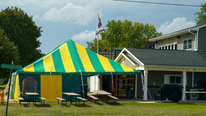 large tent with striped tent top