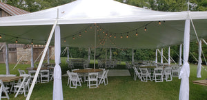 pole tent decorated for wedding